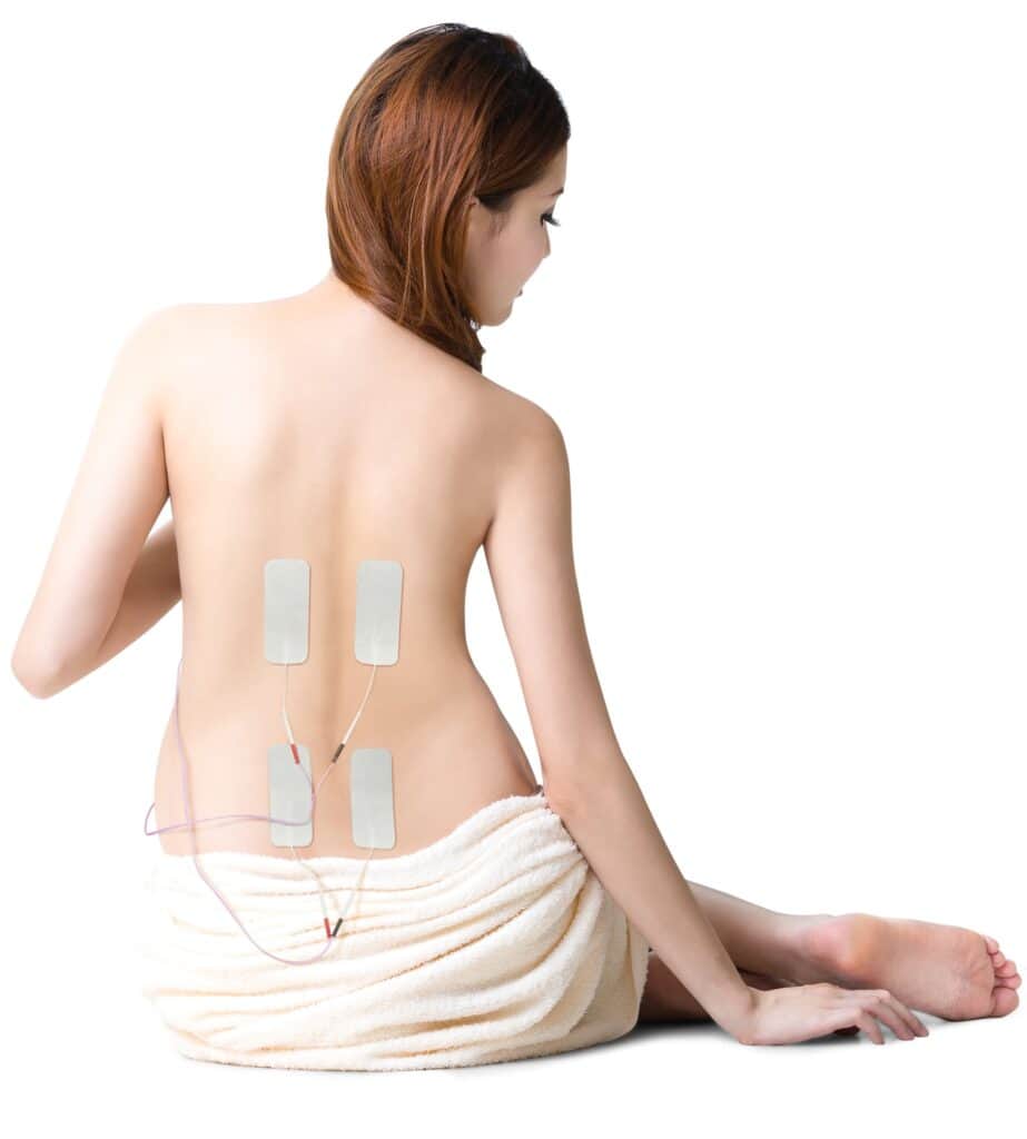 Woman with electrode pads on lower back